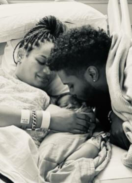 Cara Mia Wayans with her boyfriend and newborn baby.